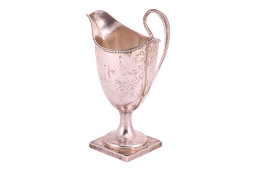 Lot 295 - A George III Newcastle silver helmet cream jug;...