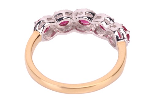 Lot 194 - A ruby and diamond cluster ring in 18ct gold,...