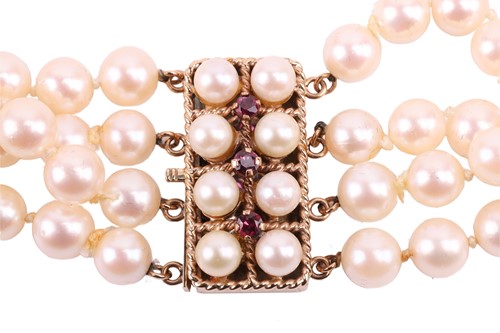 Lot 9 - A four-strand pearl choker necklace, the...