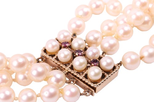 Lot 9 - A four-strand pearl choker necklace, the...