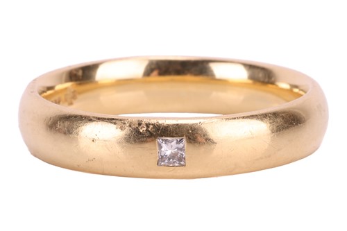 Lot 129 - A diamond-set wedding band in 18ct yellow gold,...