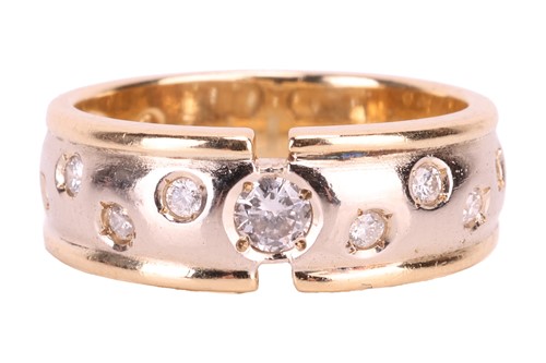 Lot 131 - A diamond set band ring. The principle ...