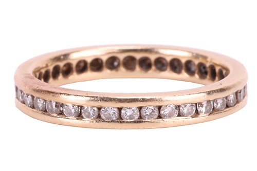 Lot 177 - A diamond eternity ring, channel-set with an...