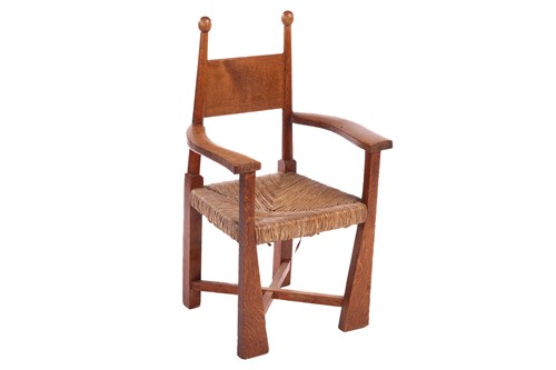 Lot An Arts & Crafts oak rush-seated child's chair,...