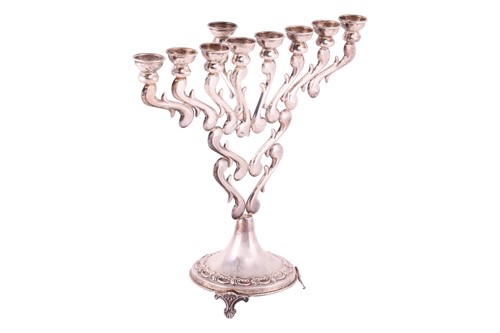 Lot 116 - A Hanukkah menorah, a candelabrum with nine...