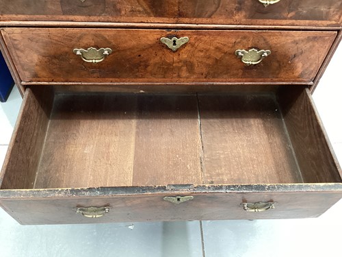 Lot 111 - A 17th-century and later figured walnut chest...
