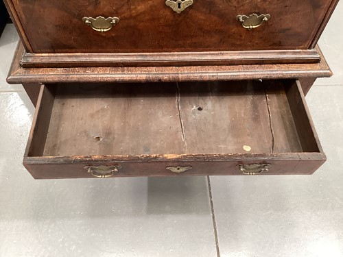 Lot 111 - A 17th-century and later figured walnut chest...