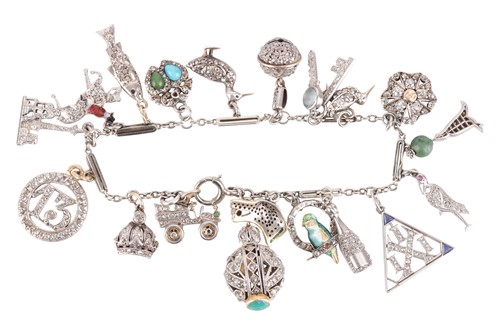 Lot 52 - An Art Deco gem-set charm bracelet, two signed...