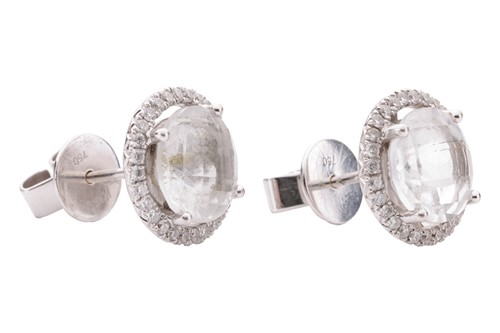 Lot 104 - A pair of topaz and diamond halo stud earrings,...