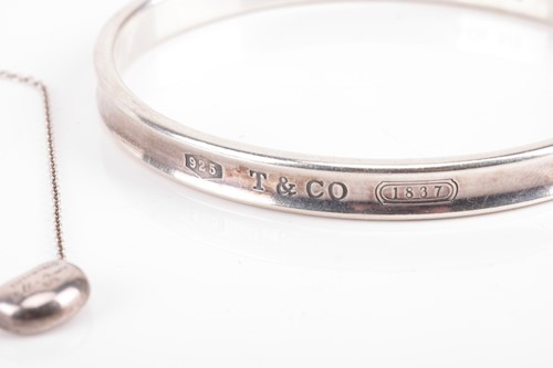 Lot 8 - Tiffany & Co. - an 1873 closed bangle and an...