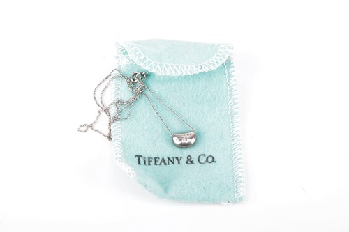 Lot 8 - Tiffany & Co. - an 1873 closed bangle and an...