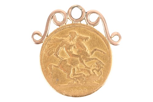 Lot 13 - A mounted double sovereign pendant, consisting...