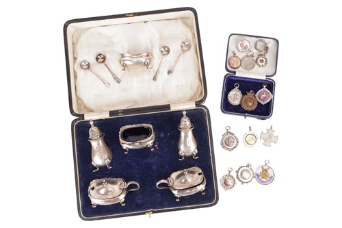 Lot 44 - A boxed set of silver pepperettes, mustards...