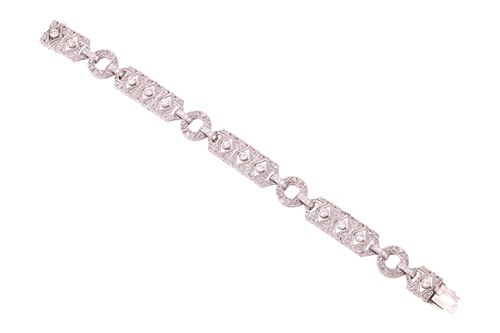 Lot 97 - An Art Deco diamond bracelet, set throughout...