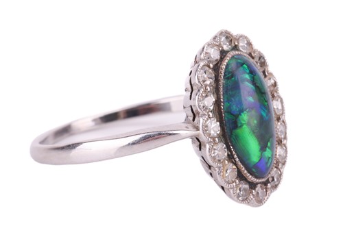 Lot 93 - An opal doublet and diamond cluster dress ring,...