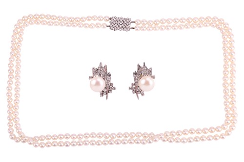 Lot A double-row cultured pearl necklace with...