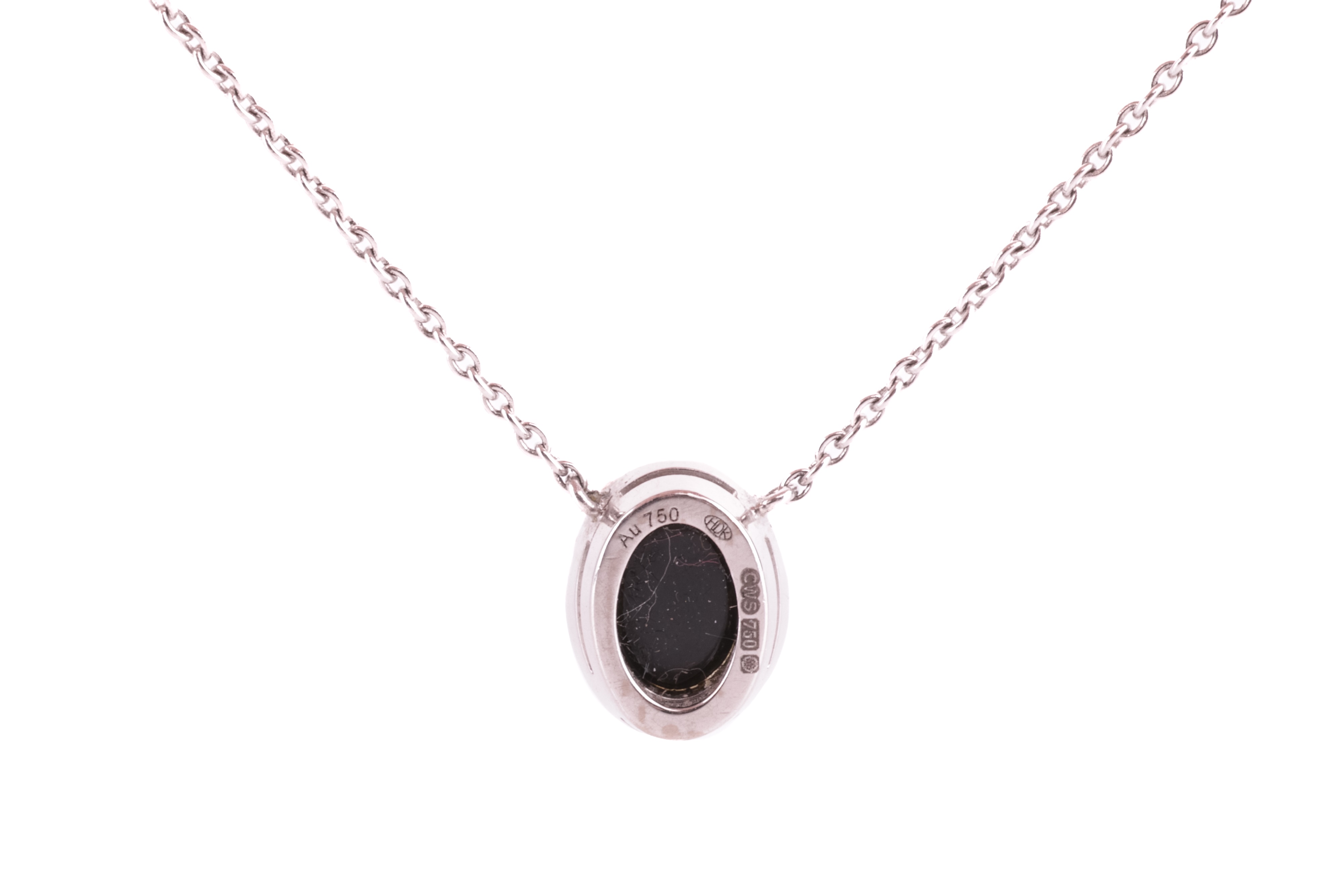 Lot 8 - A jet and diamond halo pendant, set in 18ct