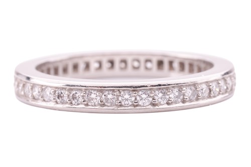 Lot 21 - A diamond-set full eternity ring, featuring...