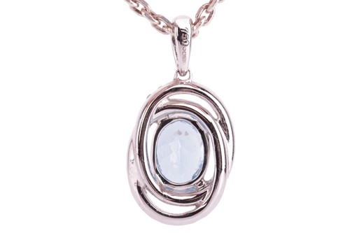 Lot 28 - An aquamarine and diamond-set oval pendant,...