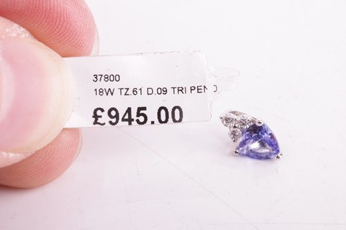 Lot 73 - A tanzanite and diamond-set pendant, featuring...