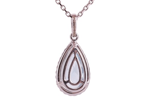 Lot 86 - An aquamarine and diamond pendant, featuring a...