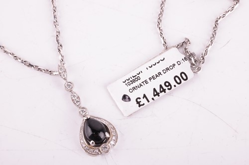 Lot 55 - A jet and diamond-set drop pendant, the...