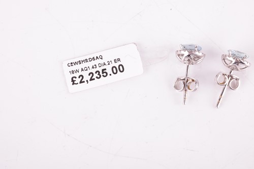 Lot 118 - A pair of aquamarine and diamond halo earrings,...
