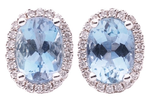Lot 72 - A pair of aquamarine and diamond cluster stud...