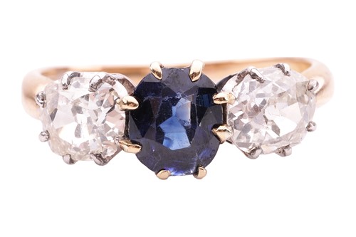 Lot 141 - A sapphire and diamond trilogy ring, centred...