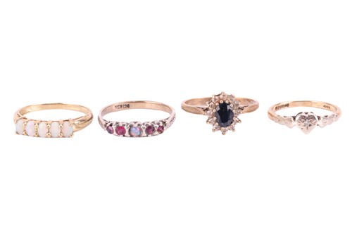 Lot 93 - Four gem set rings, comprising a sapphire and...