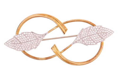 Lot 12 - A diamond-set leaf brooch, depicting two leaf...