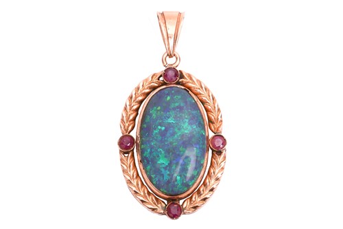 Lot 6 - An opal and ruby pendant, featuring a large...
