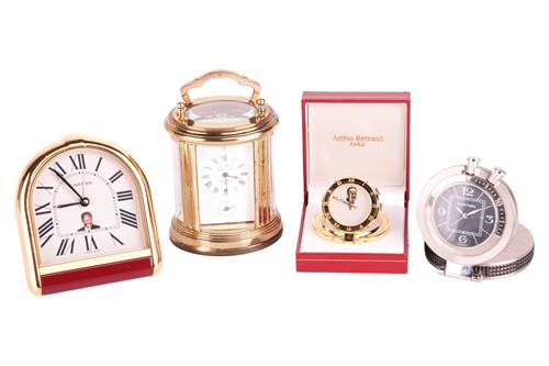 Lot 76 - A collection of four travel clocks. Featuring...