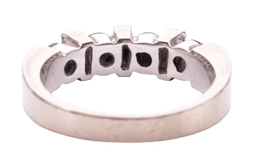 Lot 125 - A seven-stone diamond half hoop ring, the...