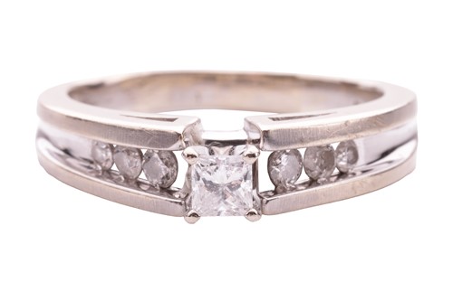 Lot A single-stone diamond ring; the princess-cut...