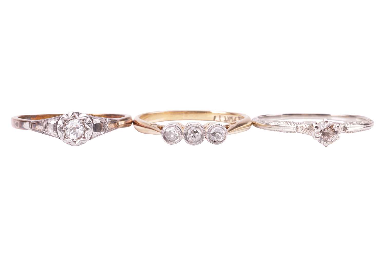 Lot 25 - A group of three diamond rings, including a