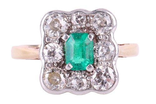 Lot 40 - An emerald and diamond cluster ring, centred...