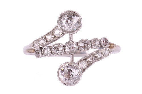 Lot 162 - An Edwardian diamond cross over ring by Henry...