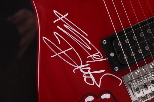 Lot 163 - The Rolling Stones: an electric guitar signed...