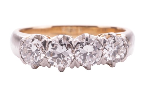 Lot A four stone half hoop diamond ring; the four...