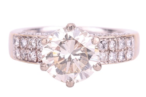 Lot 106 - A diamond solitaire ring with diamond set...