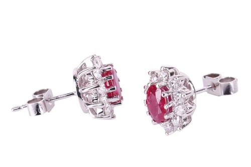 Lot 75 - A pair of ruby and diamond cluster earrings,...