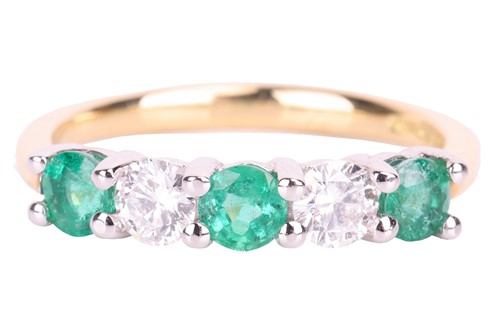 Lot 52 - An emerald and diamond half-hoop ring in 18ct...