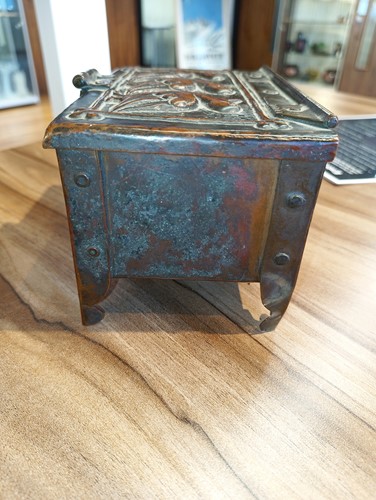 Lot 31 - An Arts and Crafts Newlyn copper table box by...