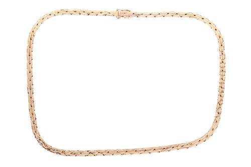 Lot 38 - A flat cobra link necklace in 18ct yellow gold,...