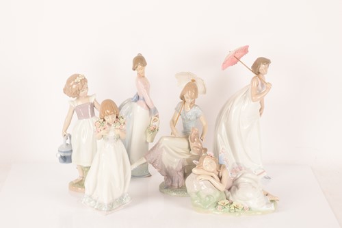 Lot 64 - Lladro: A collection of figurines comprising...