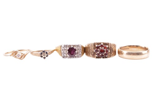 Lot 15 - A collection of five rings; to include a...