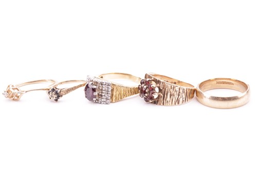 Lot 15 - A collection of five rings; to include a...