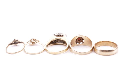 Lot 15 - A collection of five rings; to include a...