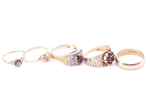 Lot 15 - A collection of five rings; to include a...